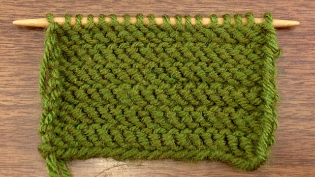 Example of the wrong side of stockinette with purl rows worked through the back loop