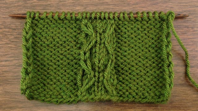 Example of the Slipped Double Chain Cable Stitch on a Reverse Stockinette Background