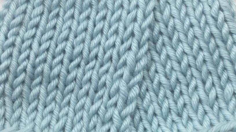 Example of the Purl Two Together Decrease wrong side close up